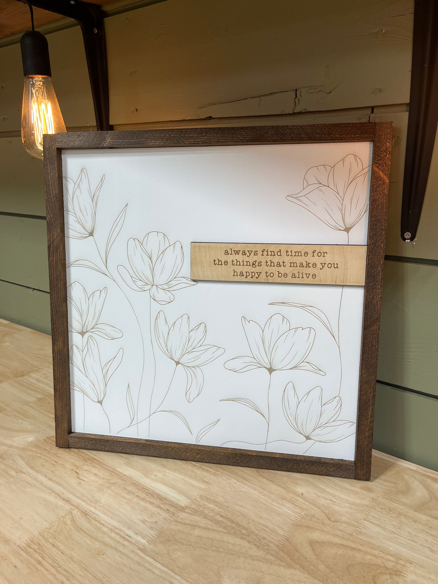 “Find time for the things that make you happy to be alive” sign